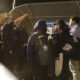 Customs and Border Protection agents question families who have presented themselves at the Paso del Norte bridge to request asylum on May 11, 2023. (Photo by Corrie Boudreaux for Source NM)