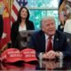 President Donald Trump speaks to reporters after signing executive orders in the Oval Office on April 23, 2025. Secretary of Commerce Howard Lutnick, Secretary of Labor Lori Chavez-DeRemer and Secretary of Education Linda McMahon look on. (Photo by Chip Somodevilla/Getty Images)  